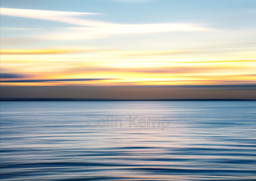 Minimalist Seascape with gold blue colours Ripples 
 Ripples, Thames Estuary, photographed with an intentional camera movement (ICM) technique to focus on the blue and gold colours rather than the detail. (SeascapePan3) 
 Keywords: Fine art, Seascape, ICM, blue, gold, ripples, minimalist, abstract, sunset