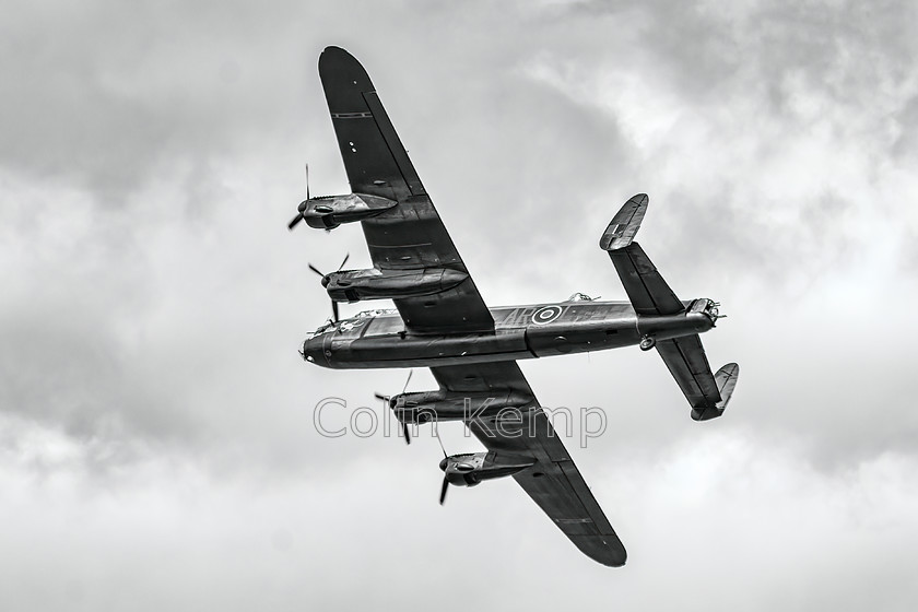 Lancaster Bomber 0644-Edit-Edit-Edit 
 Lancaster Bomber in flight during 60th Anniversary year of the Battle of Britain Memorial Flight - pictured at Fairford International Air Tattoo. 
 Keywords: Battle of Britain, Etsy, Fairford, Lancaster, air display, airshow, vintage aircraft, WWII aircraft, black and white photography