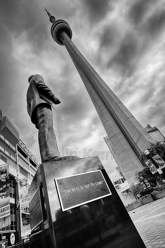 Toronto-CN-Tower-and-Rogers-statue 
 Toronto, a powerful image of the CN Tower and Rogers Monument - part of a photographic series of iconic towers 
 Keywords: Toronto Rogers Centre CN Tower black and white