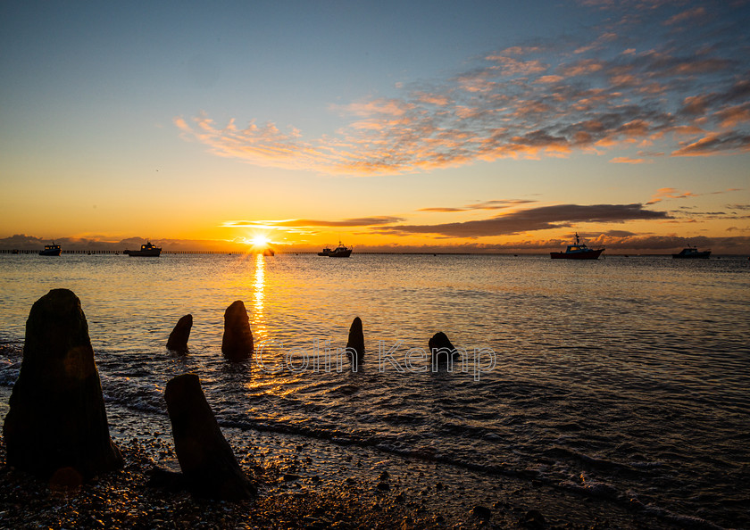 East-Beach-Sunrise-Print 
 Sunrise on Thames Estuary at Shoeburyness, East Beach, with remains of an old jetty silhouetted against a quiet tide. A peaceful dawn scene in this photographic print. 
 Keywords: East Beach, Shoeburyness, Southend on Sea, Dawn photography, seaside print, sunrise over water